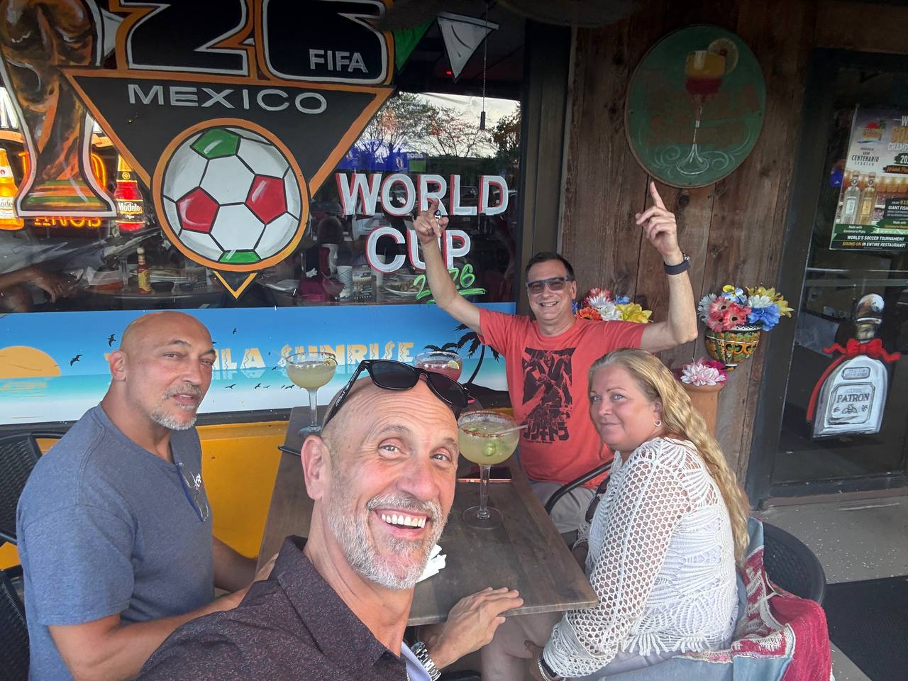 June 25, 2026 Thirsty Thursday photo with Jim in front, Jess in a white blouse with blond hair, Thad in a red shirt, and Rob on the left in a blue shirt.